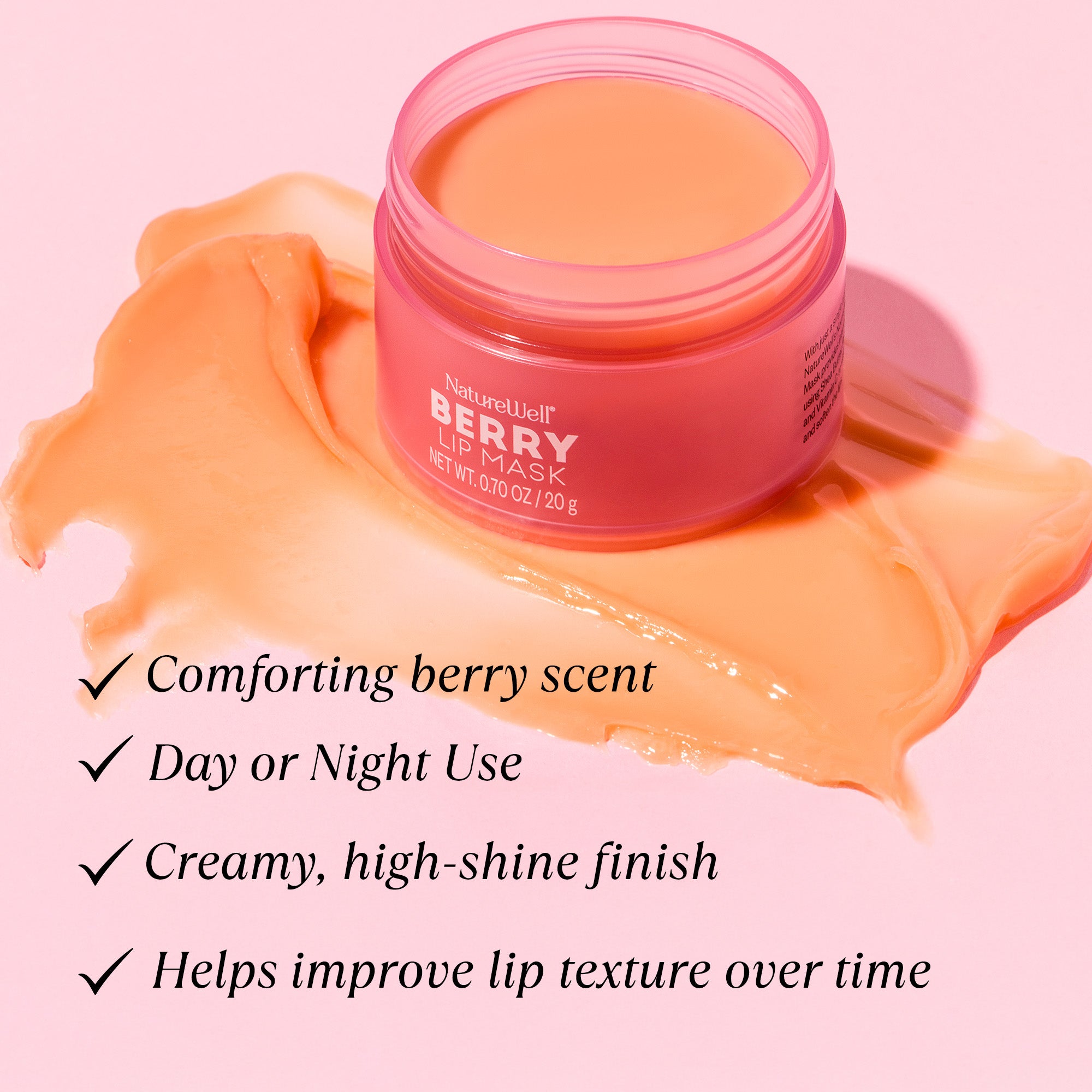 Open jar of NatureWell Berry Lip Mask on a light pink background with benefits