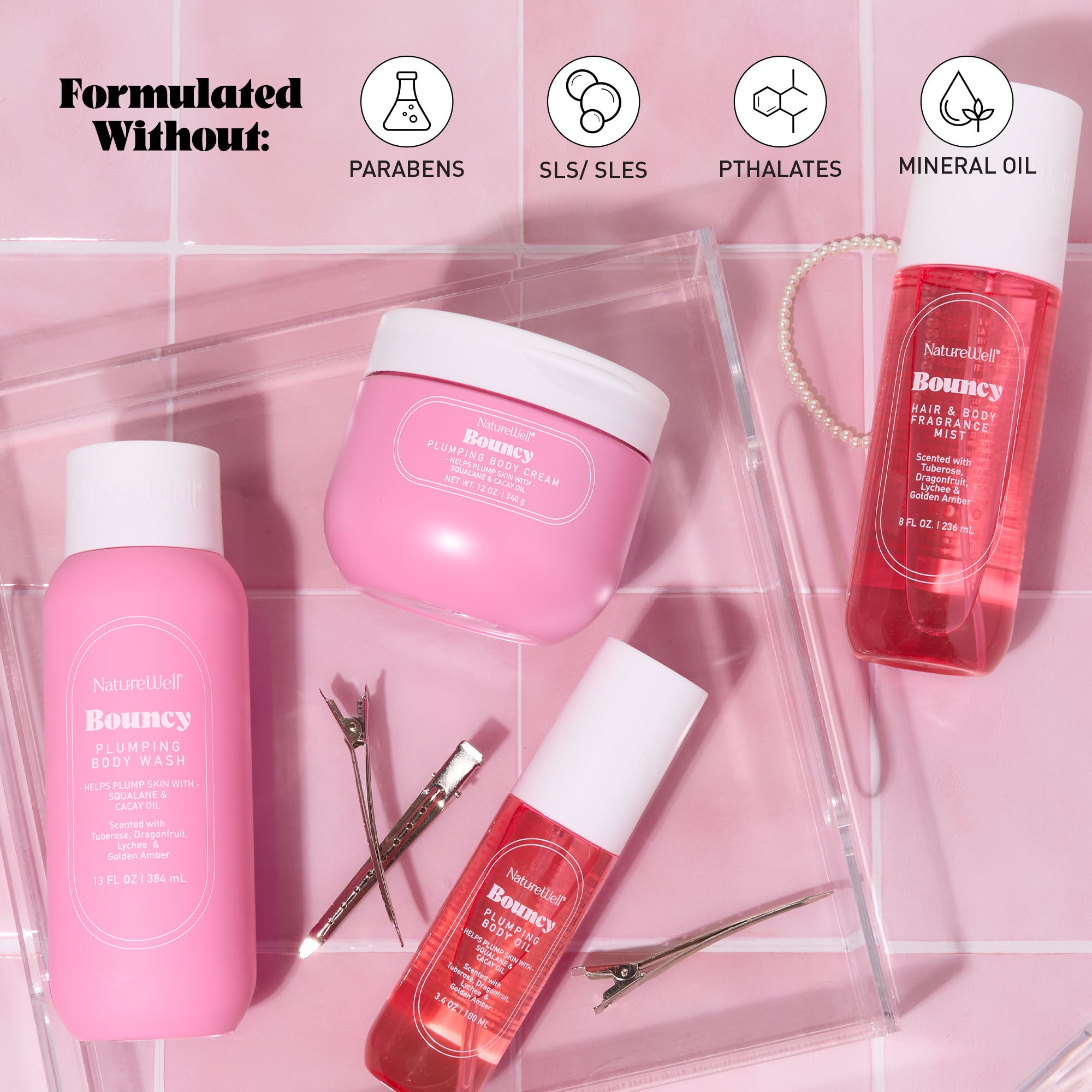 Collection of NatureWell Bouncy bodycare products on a pink background