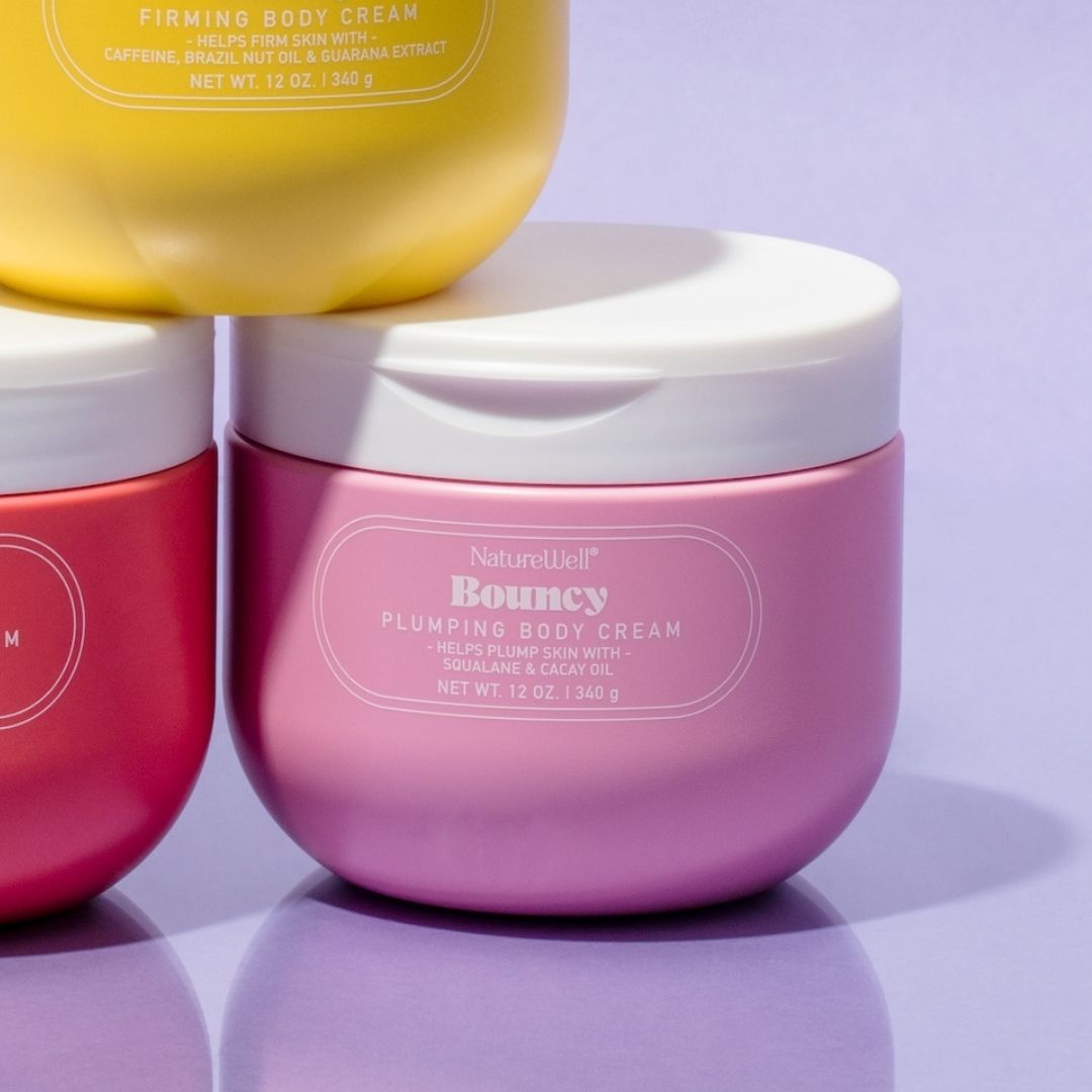 Jar of NatureWell Bouncy Plumping Body Cream on a purple background