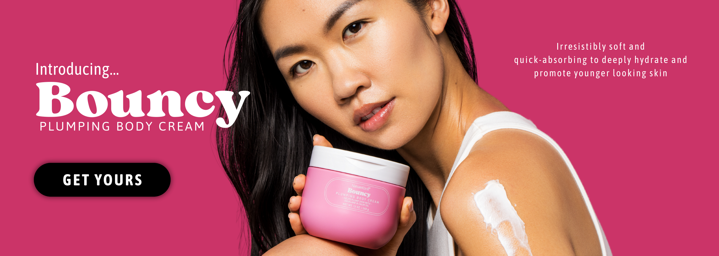 Woman holding jar of NatureWell Bouncy Plumping Body Cream on a pink background
