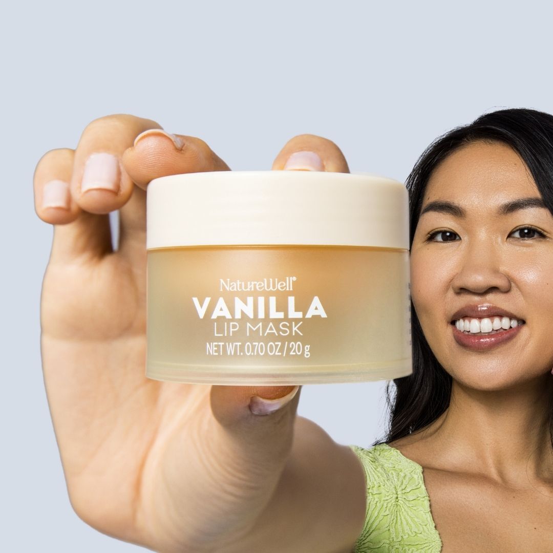 Woman holding a jar of NatureWell Vanilla Lip Mask