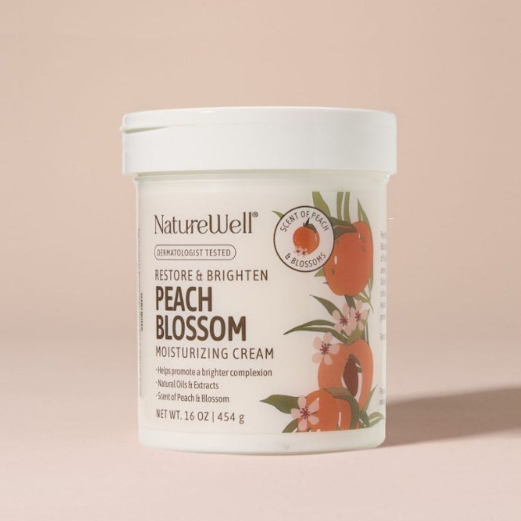 Jar of NatureWell Peach Blossom Moisturizing Cream on a tan background