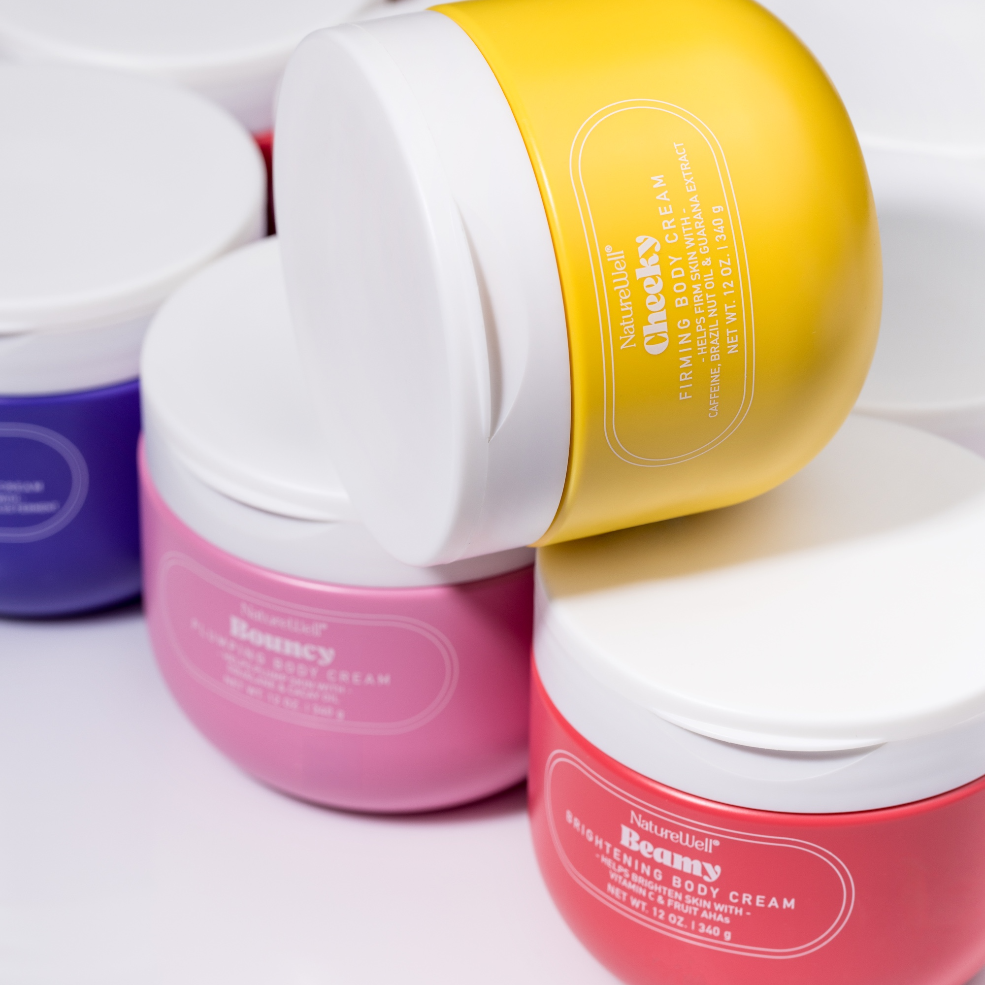 Assortment of NatureWell body creams on a white background