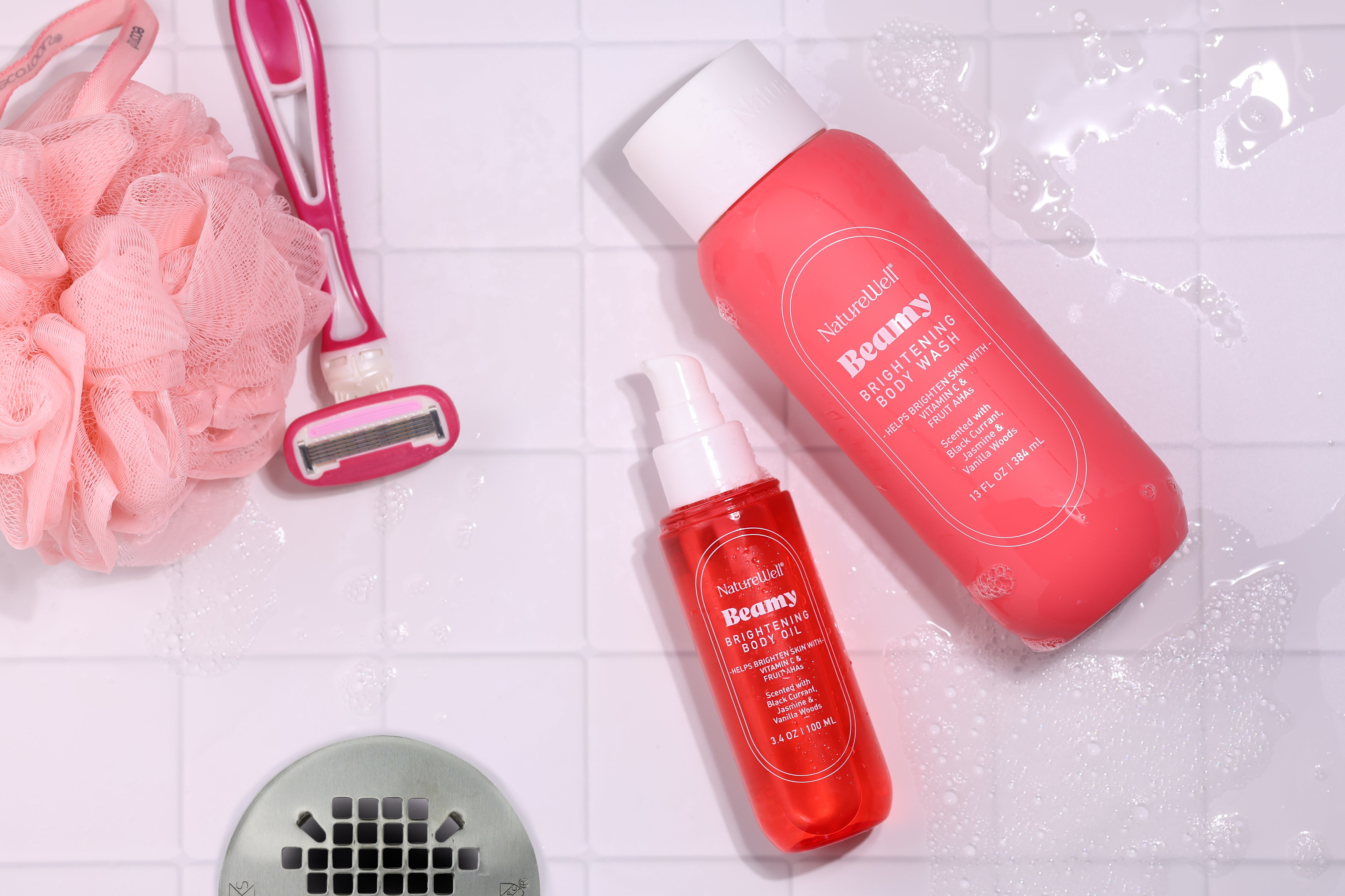 Bottles of NatureWell Beamy Brightening Body Oil and Brightening Body Wash