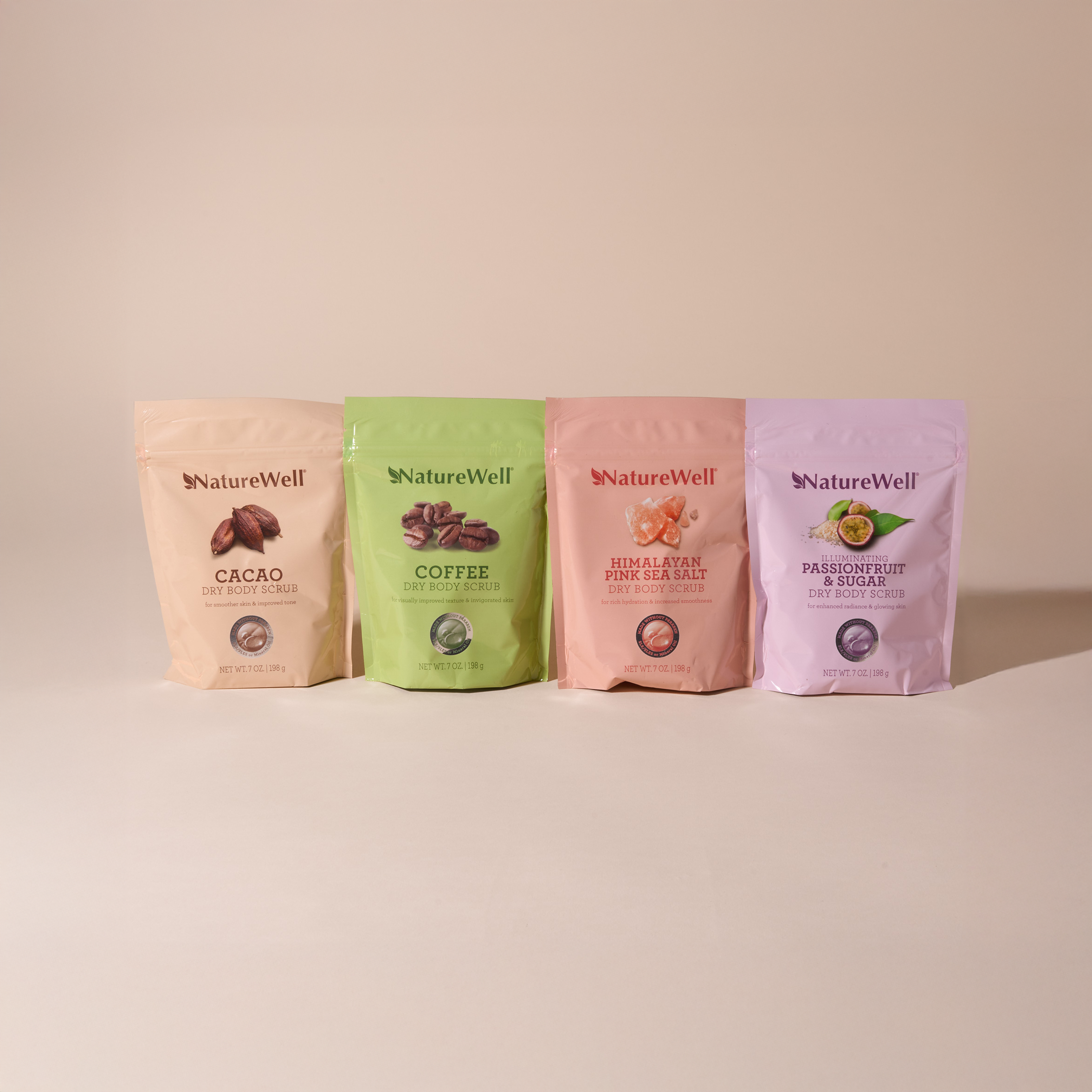 assortment of 4 colorful 7 ounce bags of exfoliating skin scrubs