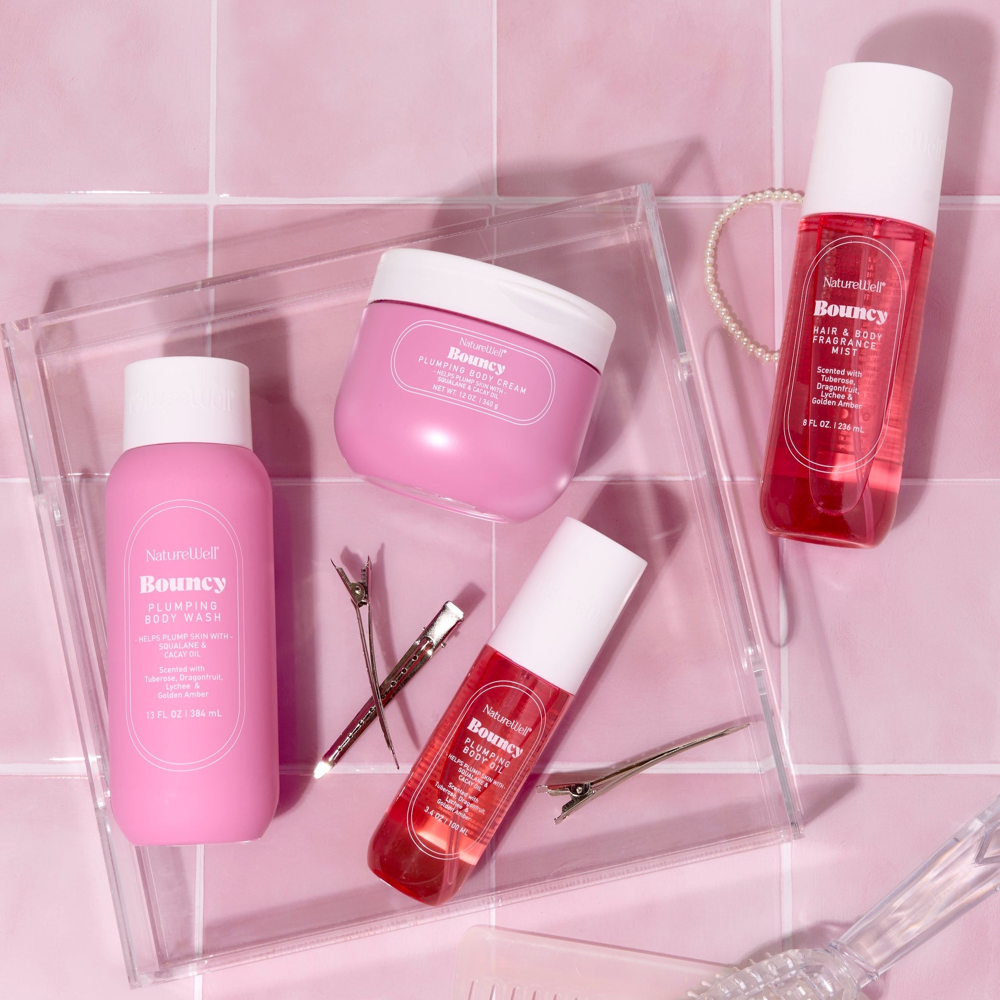 Collection of NatureWell Beamy bodycare products on a pink background