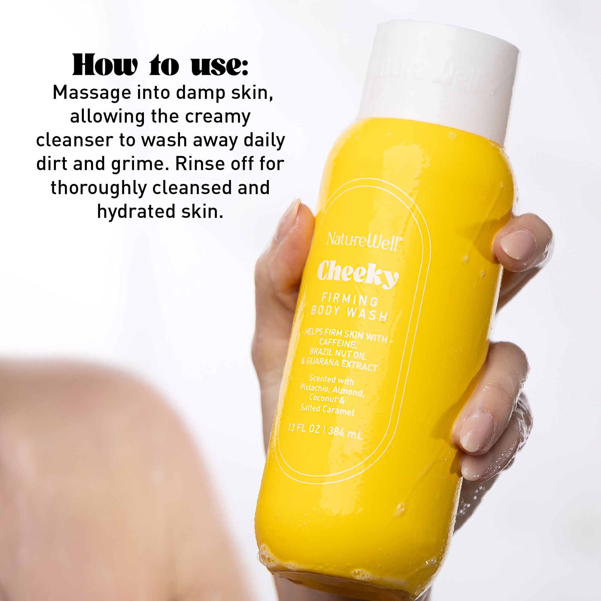Woman holding a bottle of NatureWell Cheeky Firming Body Wash on a white background with text overlay