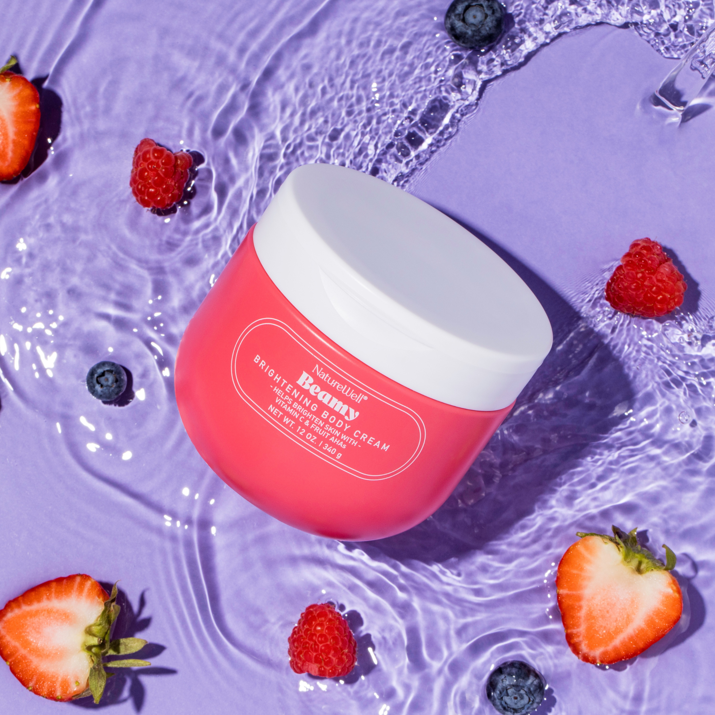 Jar of NatureWell Beamy Brightening Body Cream on a purple background