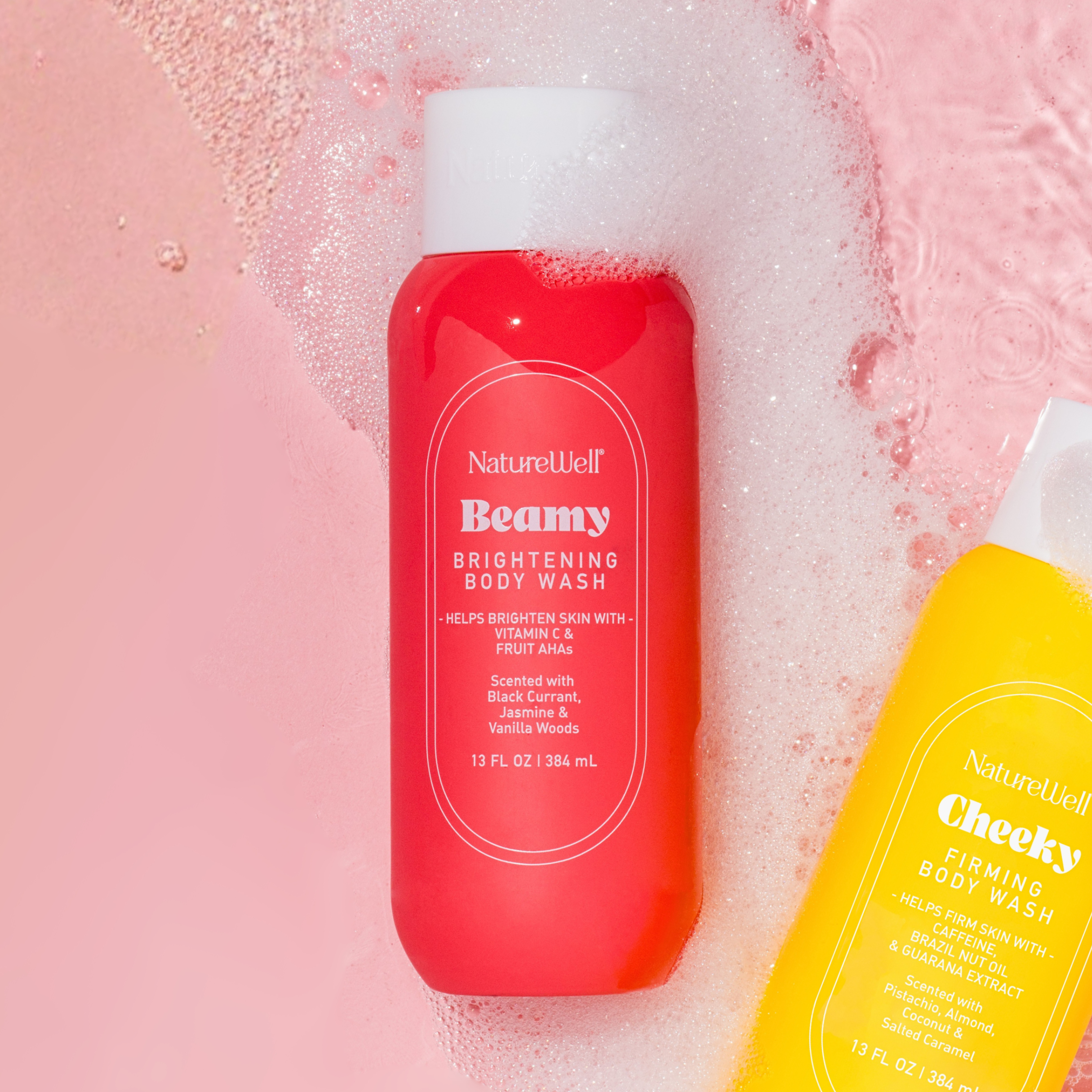 Bottle of NatureWell Beamy Brightening Body Wash surrounded by suds