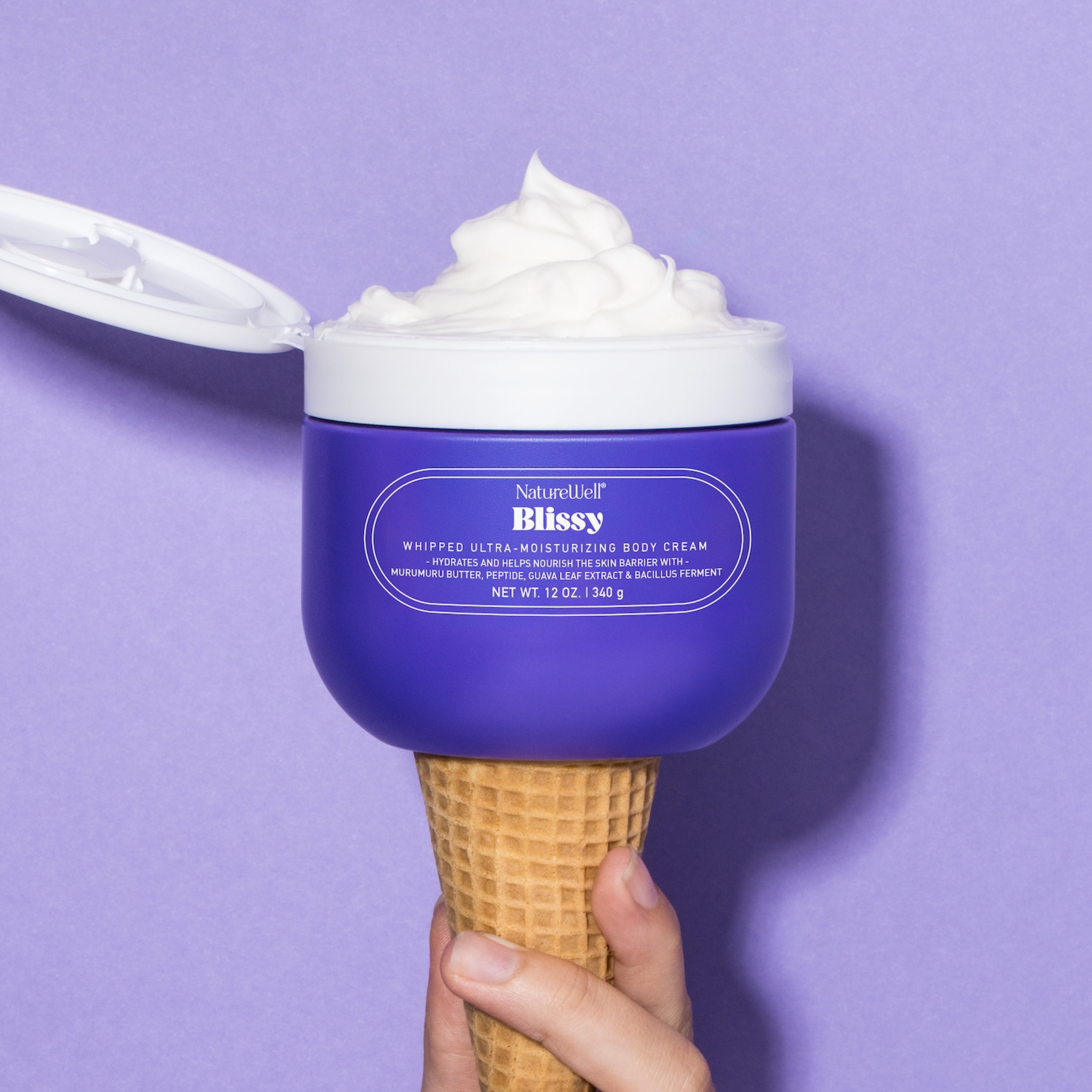 Jar of NatureWell Blissy Body Cream on a purple background