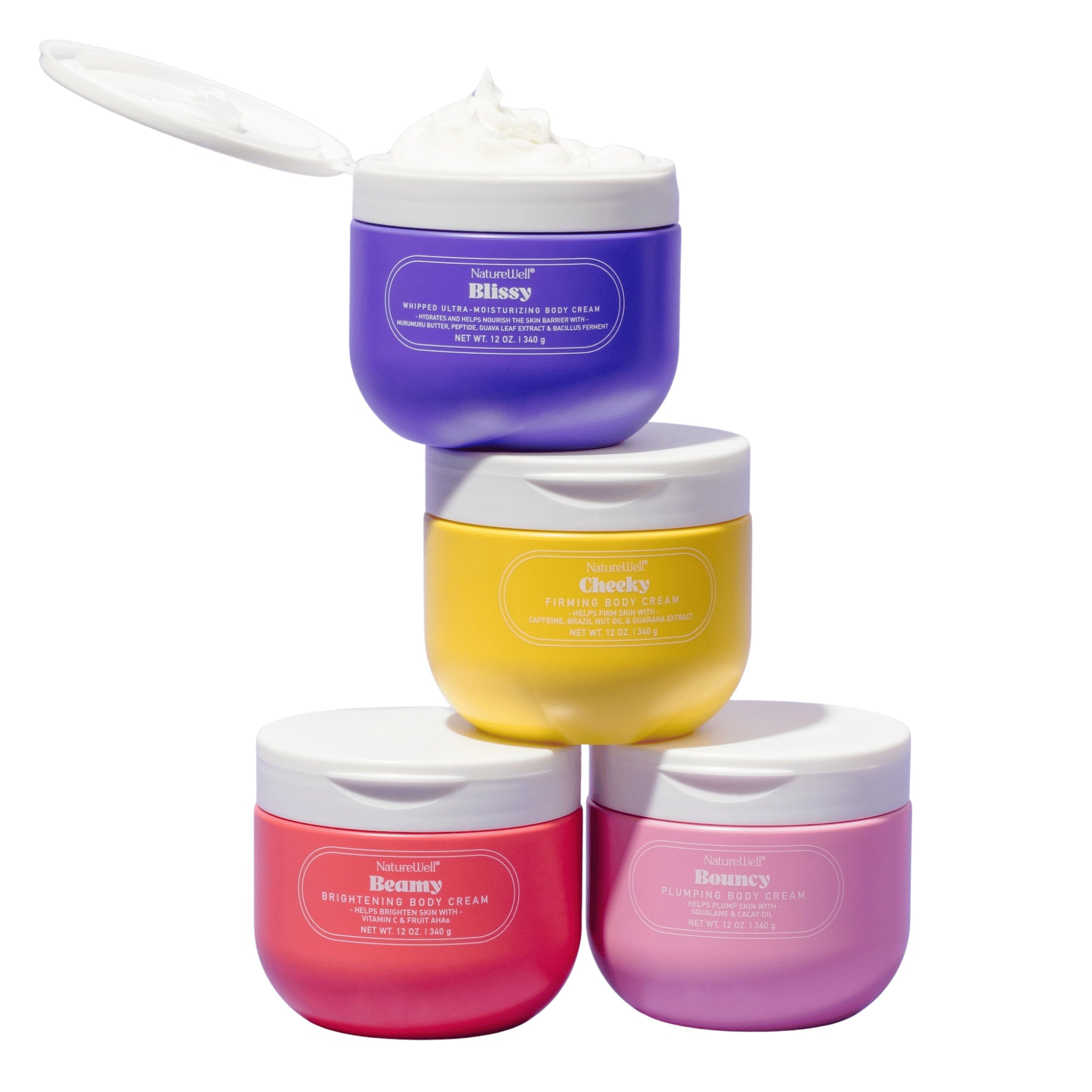 Assortment of four jars of NatureWell body creams on a white background