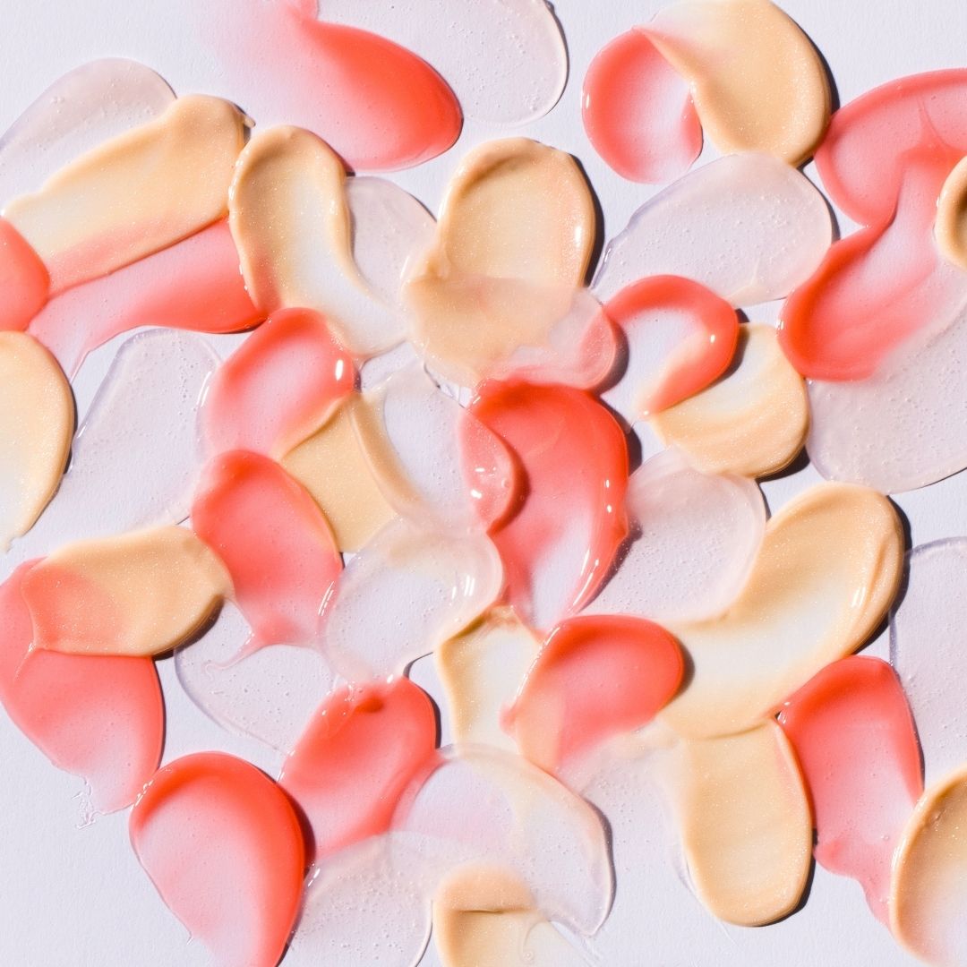 Assortment of swatches of NatureWell Tinted Lip Butters in 3 different shades