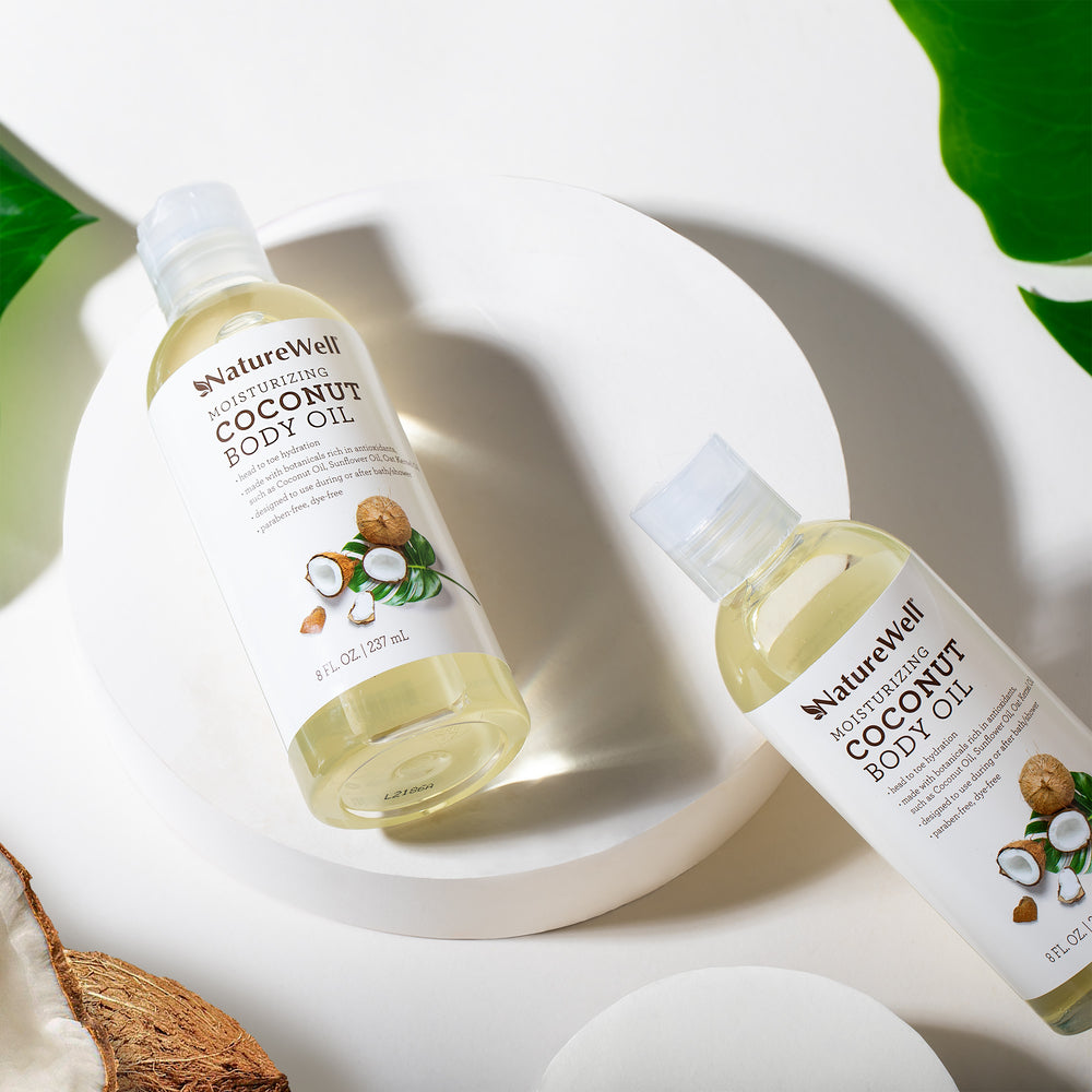 2 bottles of NatureWell Moisturizing Coconut Body Oil