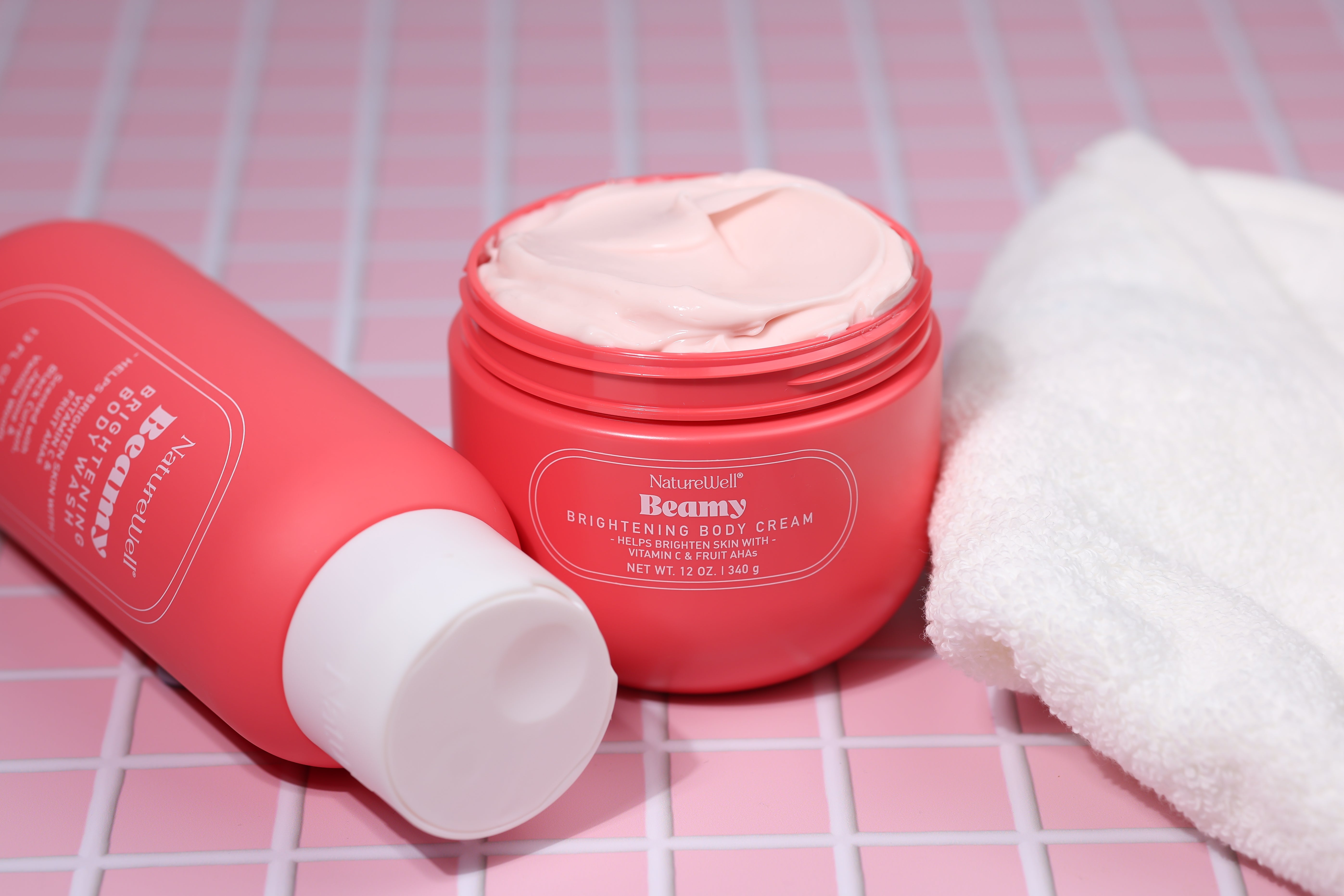 Bottle of NatureWell Beamy Brightening Body Wash and Jar of Beamy Brightening Body Cream