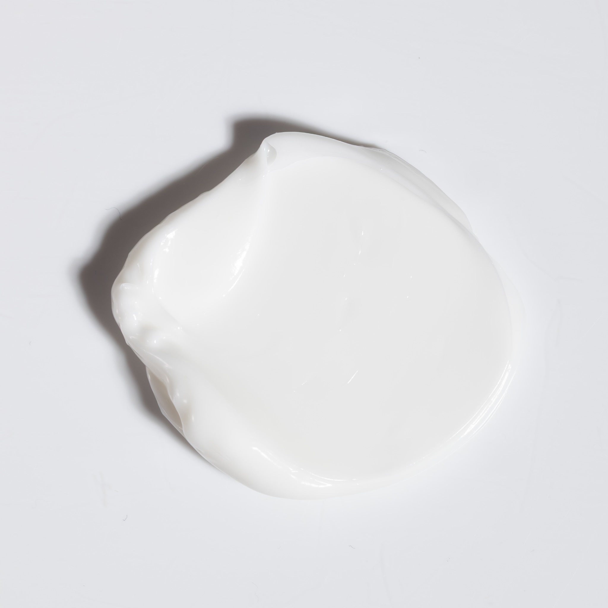 Close-up swatch of NatureWell SunDaze Conditioner on a white background