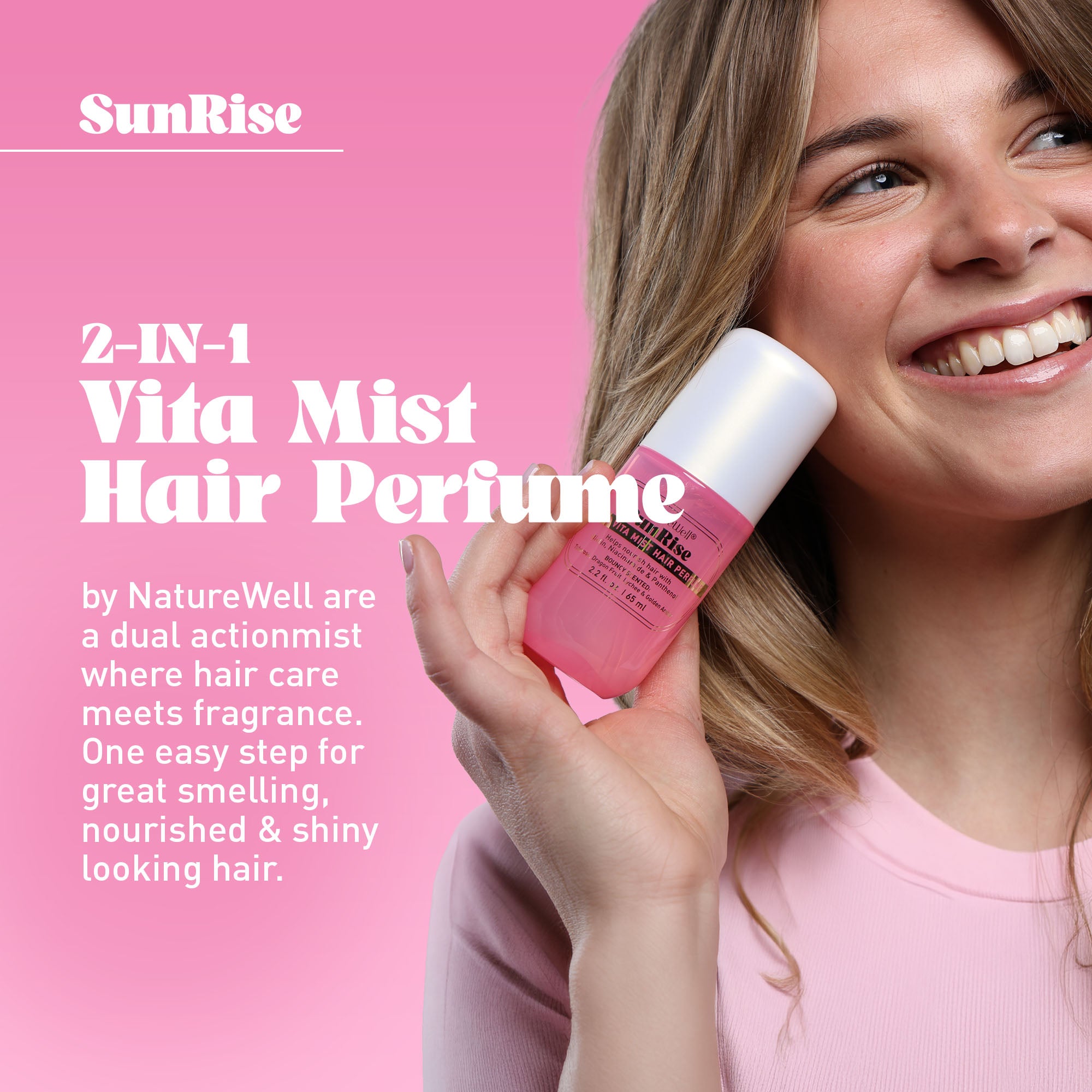 Woman holding NatureWell SunRise hair perfume on a pink background with text overlay