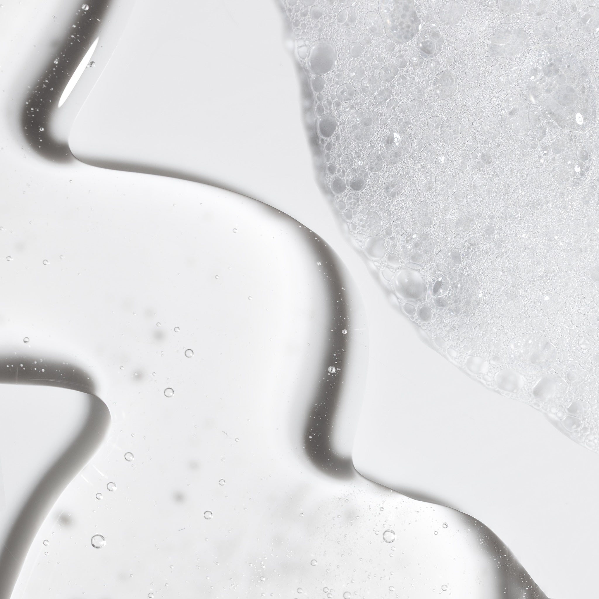 Close-up swatch of NatureWell SunRise Shampooo on a white background