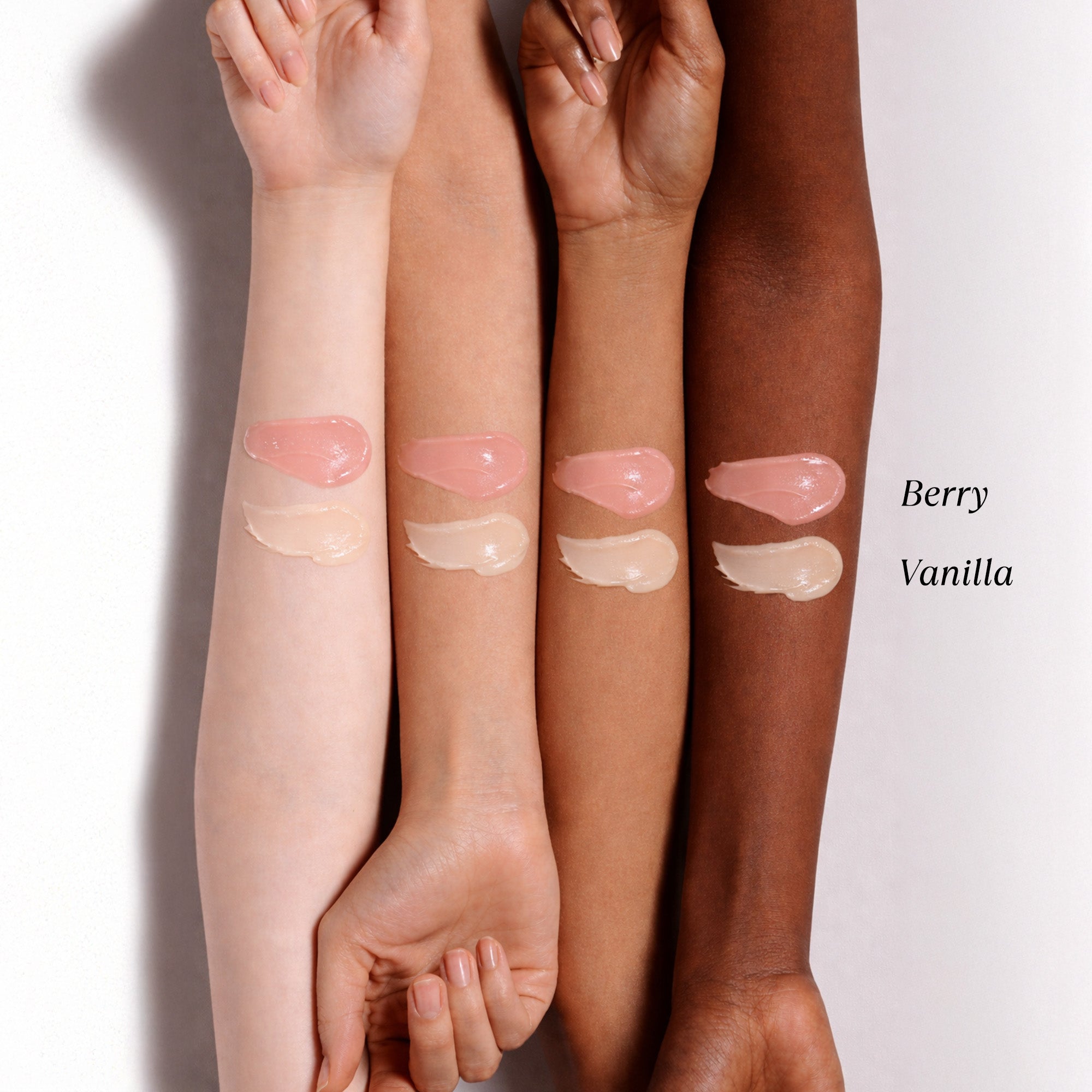Swatches of NatureWell Lip Masks on a variety of different skin tones