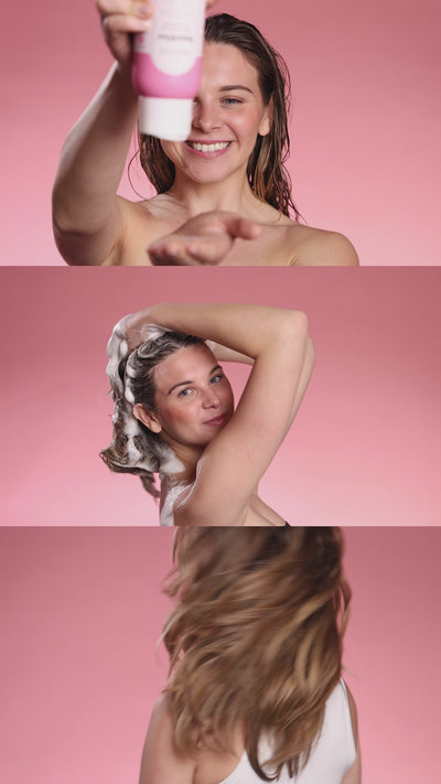 Woman applying NatureWell SunRise Volumizing Shampoo