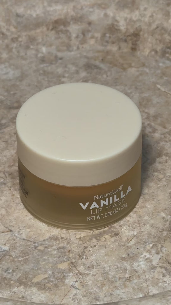 Woman using NatureWell's Vanilla Glaze Hydrating Lip Mask 