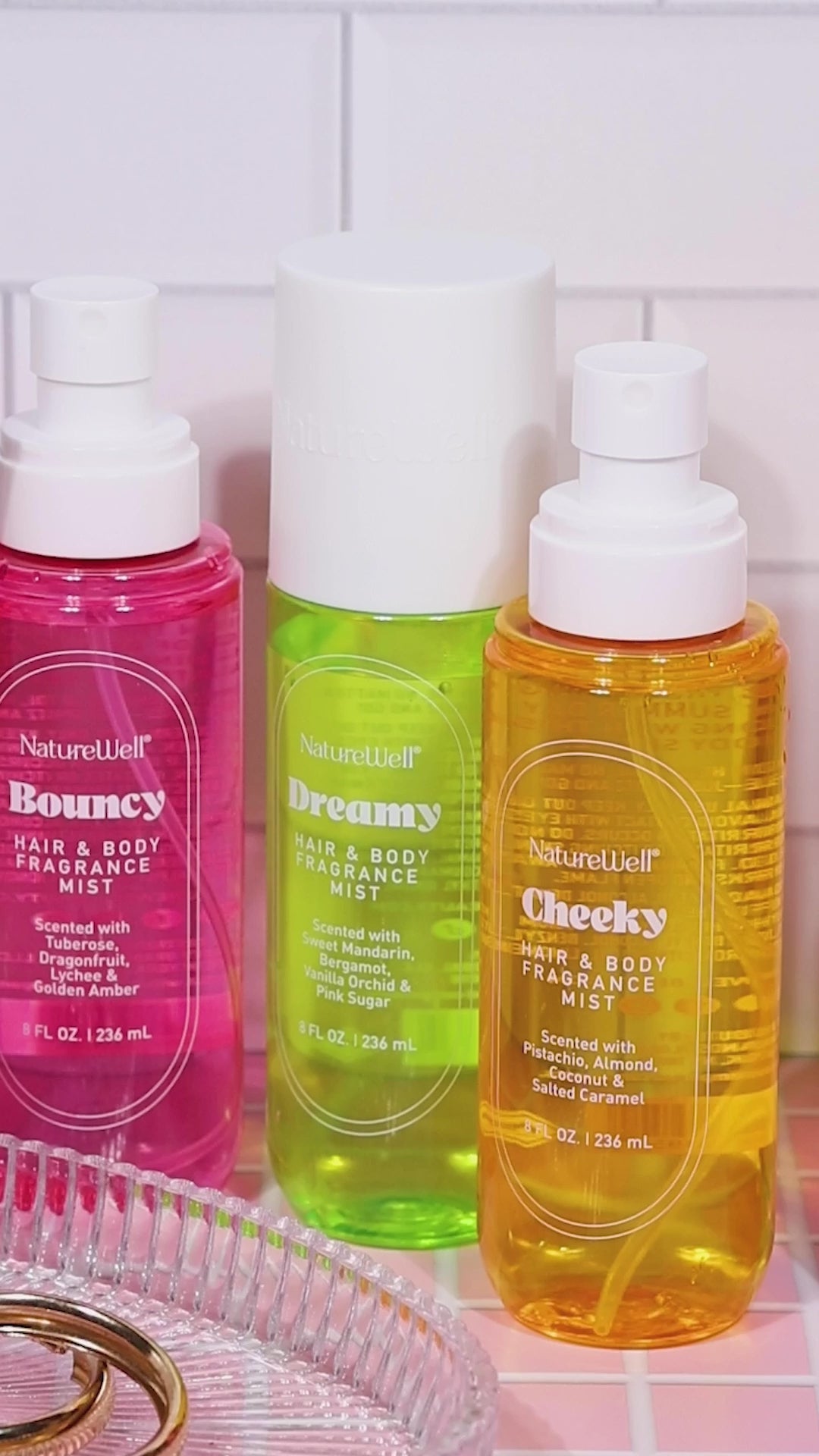 Assortment of Bottles of NatureWell Hair & Body Fragrance Mist in 3 different scents